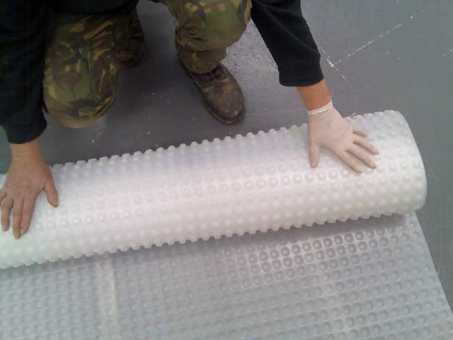Rolling out Kontract Membrane onto a floor