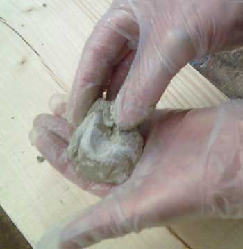 Mixing Mouldable Epoxy Putty in the gloved hand.